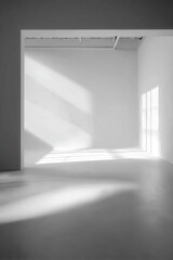 Elegant interior architectural design featuring natural light and shadows creating a minimalist aesthetic