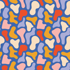 Abstract colorful pattern with seamless organic shapes in vibrant blue, red, yellow, pink, and purple colors