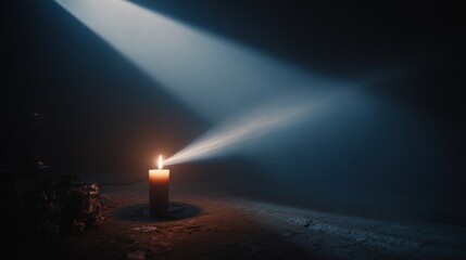 Candle illuminated in dark room