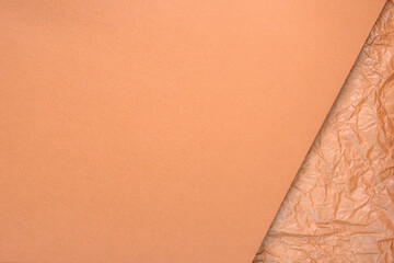 Minimalistic paper background in warm beige tones. Composition with a combination of smooth surface...