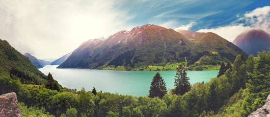 Panoramic view of Fjaerlands Fjord from Fjaerlandsfjorden viewpoint on a partly cloudy day