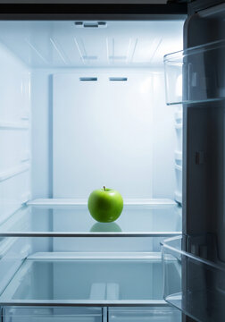 r&eacute;frig&eacute;rateur avec une pomme &agrave; l'int&eacute;rieur 