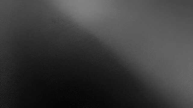 Abstract grayscale texture of gradient from light to dark, rippled and bumpy