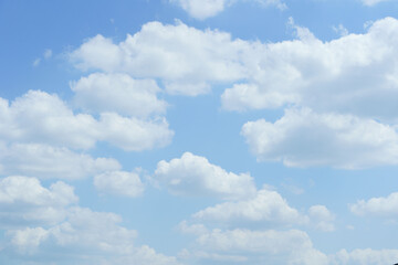 Cloudscape with fluffy cumulus and blue sky 