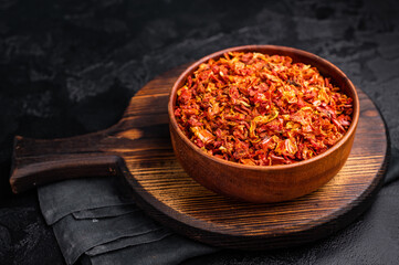 Dried and chopped Tomato for cooking. black background. top view