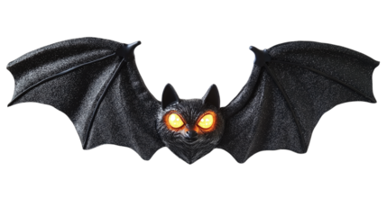 • A Halloween bat decoration with glowing eyes, isolated on white background in HD 