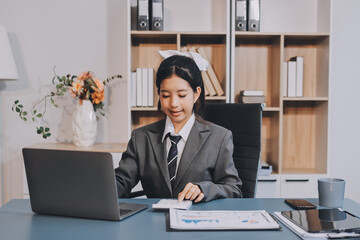 Young adult happy smiling Hispanic Asian student wearing headphones talking on online chat meeting...