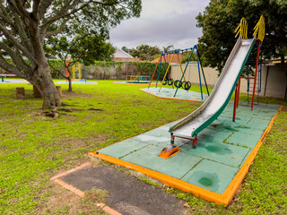 Public children's playground park on a cloudy day