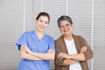 Doctor and patient healthcare in clinic support, senior woman and Caucasian doctor thumbs up after...