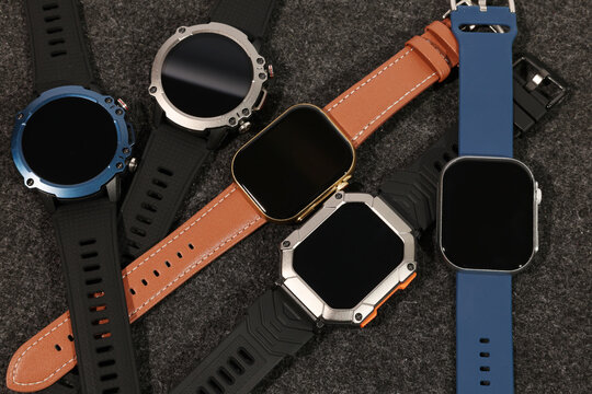 Four Smartwatches: Modern Tech, Stylish Designs, Dark Background