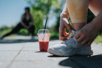 Outdoor scene highlighting relaxation and health with friends, featuring close-up focus on sneakers...