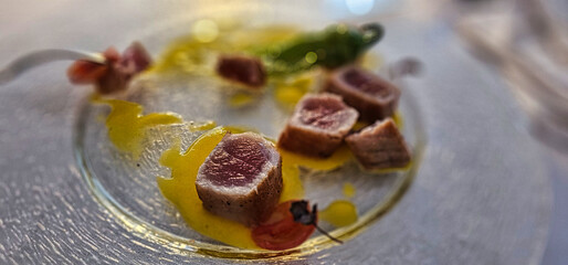 Seared tuna dish with potato cream from a Michelin-starred restaurant on the Italian Ligurian Riviera in the summer of 2025