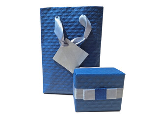 Isolated blue gift bag and gift box on white background.