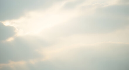 Fototapeta premium Sky with bright light shining through the clouds creating a soft and ethereal atmosphere view