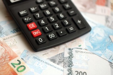 Brazilian reais banknotes and calculator. The current Brazil real money bills and calculator