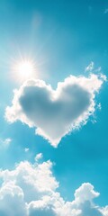 Heart-shaped cloud in the sky. The sun is shining brightly on it. The sky is blue and clear