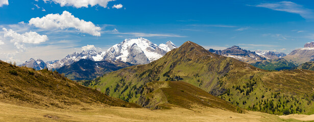 A panoramic view of Monte Civetta and the surrounding Dolomite range, featuring snow-capped peaks...