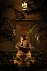 Cherub Statue in Dimly Lit Garden