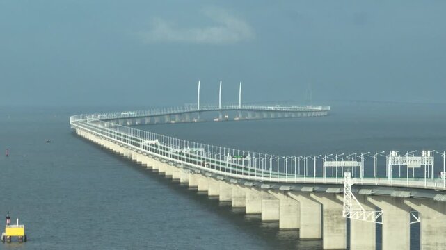 Distant aerial view of Macau Hong Kong Zhuhai Macao Bridge showcasing its impressive structure over water