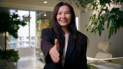 Asian Chinese business woman friendly gesture businesswoman extend hand greeting candidate hiring...