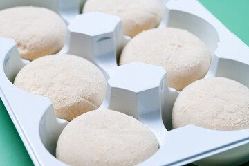 Japanese Cheesecake ice cream mochi on green background
