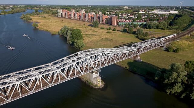Aerial View of River Meuse, Railway Bridge, and Maasboulevard District in Den Bosch, North Brabant, Netherlands