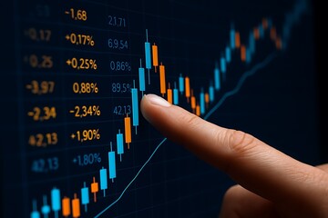 Finger pointing at glowing blue and orange stock market candlestick chart financial