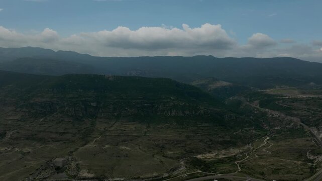 DRONE: PANNING SHOT OF THE MOUNTAINS NEAR OAXACA IN MITLA