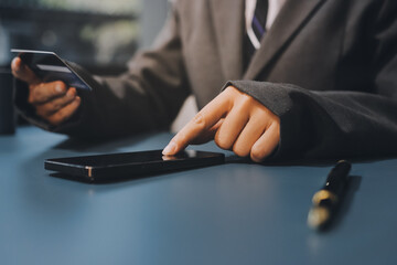 Online payment,businessman hands holding credit card and using  laptop for online shopping. Cyber...