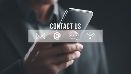 Businessman using smartphone with contact icons digital concept.