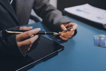 Online payment,businessman hands holding credit card and using  laptop for online shopping. Cyber Monday Concept