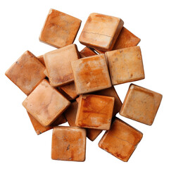 Pile of small, tan-orange square tiles