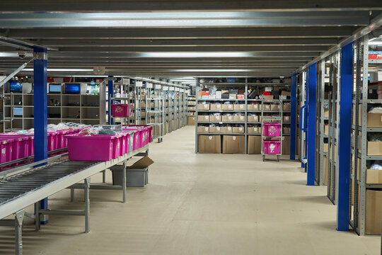 Warehouse Interior with Roller Conveyors and Pallet Jack