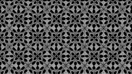 A black and white lace pattern with floral designs arranged in a repeating grid like structure