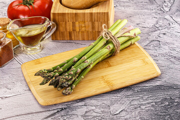 Vegan raw green asparagus heap