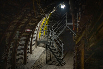 Coal mine corridor with belt conveyor and lighting