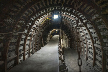 Coal mine corridor with belt conveyor and lighting