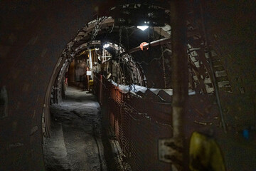 Coal mine corridor with belt conveyor and lighting