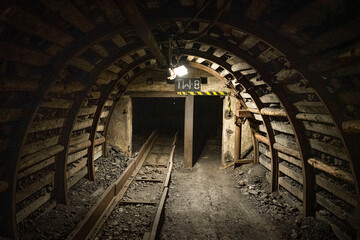 Coal mine corridor with armored face conveyor with light