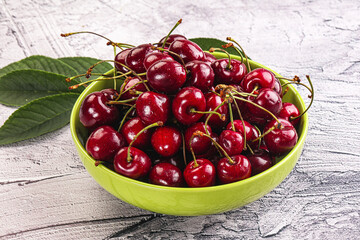 Red sweet cherry in the bowl