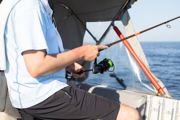 fisherman fishing, Fishing rod, spinning, fisherman against blue sky