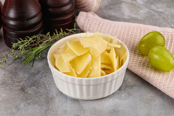 Parmesan cheese slices in the bowl
