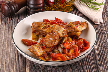 Baked lamb ribs with vegetables