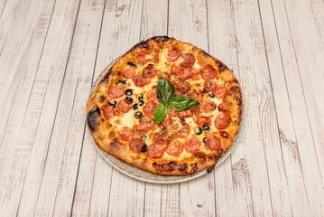  the New York-style pizza (generally larger, with a chewy dough