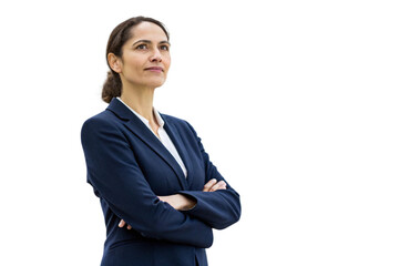 A confident businesswoman in a navy suit stands with her arms crossed looking thoughtfully towards the future isolated on transparent