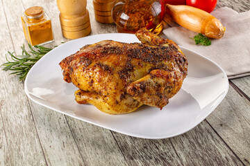 Baked in oven whole chicken with spices
