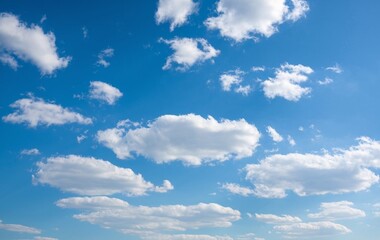 Obraz premium A clear blue sky with fluffy white clouds
