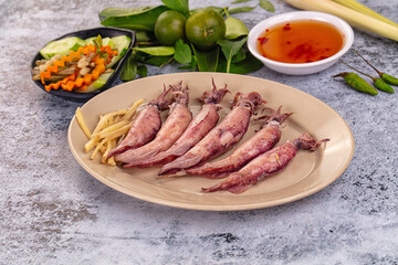Boiled wild mini calamari snack