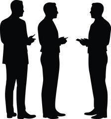 Silhouette of three business people discussing with gestures and document in hand