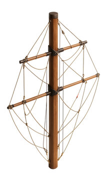 Tall wooden mast with multiple cross spars and rigging lines